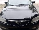 Mazda 323   2002 - Cần bán Mazda 323 đời 2002, màu đen, xe đẹp nguyên bản