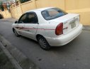 Daewoo Lanos SX 2004 - Gia đình cần bán Daewoo Lanos SX đời 2004, màu trắng, giá 72tr