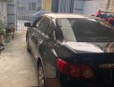 Toyota Corolla altis 1.8G MT 2009 - Bán xe Toyota Corolla Altis 1.8G sx 2009, số tay, máy xăng, màu đen, nội thất màu kem, đã đi 154000 km