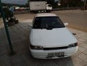 Mazda 323   1995 - Cần bán gấp Mazda 323 đời 1995, màu trắng, đèn trước sau mới thay, về chỉ việc đi