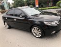 Kia Cerato AT 2009 - Cần bán Kia Cerato AT sản xuất 2009, màu đen, nhập khẩu