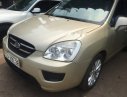 Kia Carens LX 2010 - Bán ô tô Kia Carens LX năm sản xuất 2010, màu vàng số sàn, giá 265tr