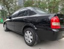 Mazda 323 2003 - Bán ô tô Mazda 323 đời 2003, màu đen xe gia đình