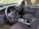 Ford Escape   XLS  2009 - Bán Ford Escape màu đen, xe gia đình ít đi