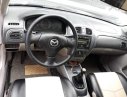 Mazda 323 2004 - Bán Mazda 323 sản xuất năm 2004, màu bạc, xe nhập