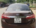 Toyota Corolla altis AT 2015 - Cần bán lại xe Toyota Corolla altis AT sản xuất 2015, màu nâu chính chủ