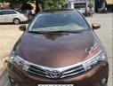 Toyota Corolla altis AT 2015 - Cần bán lại xe Toyota Corolla altis AT sản xuất 2015, màu nâu chính chủ