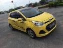 Hyundai Grand i10   2015 - Bán ô tô Hyundai Grand i10 2015, màu vàng, xe đẹp, gầm bệ chắc chắn đã nên đồ chơi