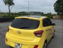 Hyundai Grand i10   2015 - Bán ô tô Hyundai Grand i10 2015, màu vàng, xe đẹp, gầm bệ chắc chắn đã nên đồ chơi