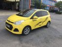 Hyundai Grand i10   2015 - Bán ô tô Hyundai Grand i10 2015, màu vàng, xe đẹp, gầm bệ chắc chắn đã nên đồ chơi