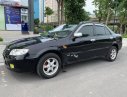 Mazda 323 2003 - Cần bán xe Mazda 323 đời 2003, màu đen, xe đẹp 