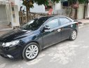 Kia Forte 2010 - Bán Kia Forte sản xuất năm 2010, màu đen số sàn