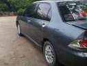 Mitsubishi Lancer   2003 - Bán ô tô Mitsubishi Lancer đời 2003, máy móc còn zin, không đâm đụng, ngập nước