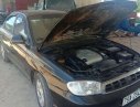 Kia Spectra   2004 - Bán Kia Spectra đời 2004, màu đen, nhập khẩu