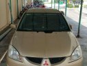 Mitsubishi Lancer 2004 - Cần bán lại xe Mitsubishi Lancer đời 2004, màu vàng xe gia đình, giá chỉ 230 triệu