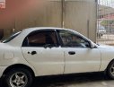 Daewoo Lanos SX 2002 - Cần bán gấp Daewoo Lanos SX đời 2002, màu trắng số sàn