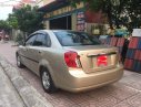 Daewoo Lacetti 2005 - Cần bán xe Daewoo Lacetti sản xuất 2005, màu vàng