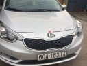 Kia K3     2014 - Cần bán gấp Kia K3 sản xuất năm 2014, màu bạc xe gia đình