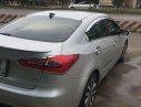 Kia K3     2014 - Cần bán gấp Kia K3 sản xuất năm 2014, màu bạc xe gia đình