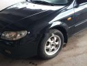 Mazda 323 2003 - Cần bán gấp Mazda 323 đời 2003, màu đen, nhập khẩu chính hãng