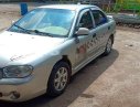 Kia Spectra 2004 - Cần bán gấp Kia Spectra 2004, màu bạc xe nguyên bản