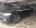 Mazda 323 2003 - Cần bán lại xe Mazda 323 đời 2003, màu đen xe còn chạy êm