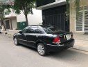 Ford Laser   2004 - Bán Ford Laser GHIA 1.8 AT sản xuất 2004, màu đen, số tự động 