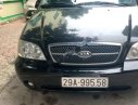 Kia Carnival GS 2.5 AT 2009 - Bán xe Kia Carnival GS2.5AT sản xuất năm 2009, màu đen chính chủ, 268 triệu