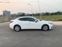 Mazda 3 2016 - Cần bán lại xe Mazda 3 sản xuất 2016, màu trắng xe còn mới lắm