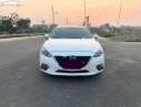 Mazda 3 2016 - Cần bán lại xe Mazda 3 sản xuất 2016, màu trắng xe còn mới lắm