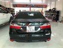 Toyota Camry 2016 - Cần bán gấp Toyota Camry 2.0E đời 2016, màu đen xe còn mới nguyên