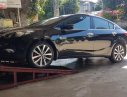 Kia K3 2015 - Bán Kia K3 1.6 AT năm sản xuất 2015, màu đen xe còn mới lắm