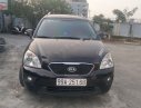 Kia Carens   2012 - Bán xe Kia Carens đời 2012, màu đen xe còn mới lắm