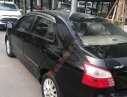 Toyota Vios  E 2011 - Bán ô tô Toyota Vios E sản xuất năm 2011, màu đen xe gia đình, giá tốt