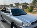 Hyundai Santa Fe Gold 2.0 AT 2004 - Cần bán gấp Hyundai Santa Fe năm sản xuất 2004, màu bạc, xe nhập chính hãng