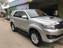 Toyota Fortuner 2014 - Cần bán gấp Toyota Fortuner G sản xuất 2014, màu bạc số sàn, giá chỉ 715 triệu