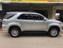 Toyota Fortuner 2014 - Cần bán gấp Toyota Fortuner G sản xuất 2014, màu bạc số sàn, giá chỉ 715 triệu