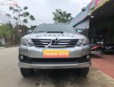 Toyota Fortuner 2014 - Cần bán gấp Toyota Fortuner G sản xuất 2014, màu bạc số sàn, giá chỉ 715 triệu