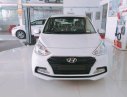 Hyundai Grand i10 2018 - Hỗ trợ mua xe trả góp lên đến 80% giá trị xe khi mua chiếc Hyundai Grand i10 sedan 1.2 MT base, sản xuất 2018, màu trắng