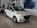 Hyundai Grand i10 2018 - Hỗ trợ mua xe trả góp lên đến 80% giá trị xe khi mua chiếc Hyundai Grand i10 sedan 1.2 MT base, sản xuất 2018, màu trắng