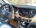 Hyundai Grand i10 2015 - Cần bán gấp Hyundai Grand i10 đời 2015, màu trắng, xe nhập số sàn, giá tốt