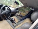 Mazda 323 2003 - Cần bán xe Mazda 323 đời 2003, màu đen