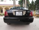 Ford Laser Ghia 1.8 MT 2003 - Cần bán gấp Ford Laser GHIA 1.8 MT năm 2003, màu đen, 132tr