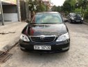 Toyota Camry 2.4G 2004 - Bán Toyota Camry 2.4G đời 2004, màu đen số sàn