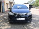 Toyota Vios 1.5E 2015 - Cần bán Toyota Vios 1.5E sản xuất năm 2015, màu đen xe gia đình