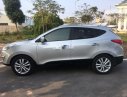 Hyundai Tucson 2011 - Cần bán lại xe Hyundai Tucson sản xuất năm 2011, màu bạc số tự động