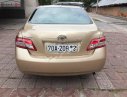 Toyota Camry LE 2.5 2009 - Cần bán xe Toyota Camry LE 2.5 sản xuất năm 2009, màu vàng, xe nhập