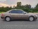 Ford Mondeo   2005 - Cần bán xe Ford Mondeo AT sản xuất 2005, màu vàng kim, xe gia đình