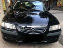 Mazda 626 2001 - Cần bán lại xe Mazda 626 đời 2001, màu đen số sàn giá cạnh tranh
