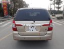 Toyota Innova 2.0E 2014 - Bán Toyota Innova 2.0 E đời 2014, màu vàng số sàn